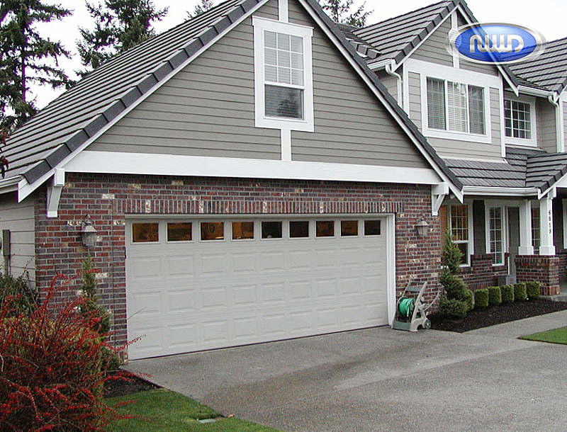 Beautiful House with a Sing White Garage Door