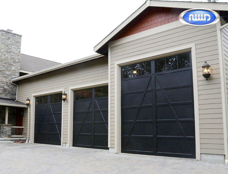 Home with 3 Black Garage doors