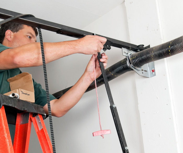 Man Repairing a Garage Door