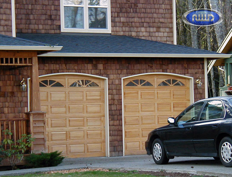 Brick home with 2 wood garage doors