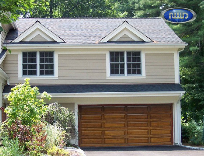 Home with a wood garage doors