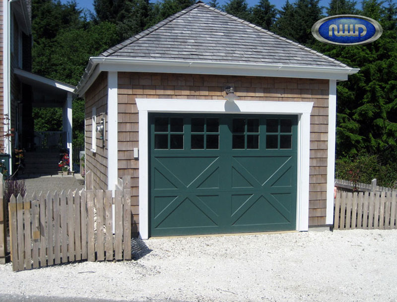 The-Township-Collection-by-Northwest-Door-1 1 Green garage door on an disconnected garage
